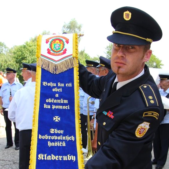 The Mayor of SDH Kladeruby, Michal Sváček, donates a beautiful memorial ribbon to the citizens at the occasion of sanctifying of the ceremonious municipal flag.